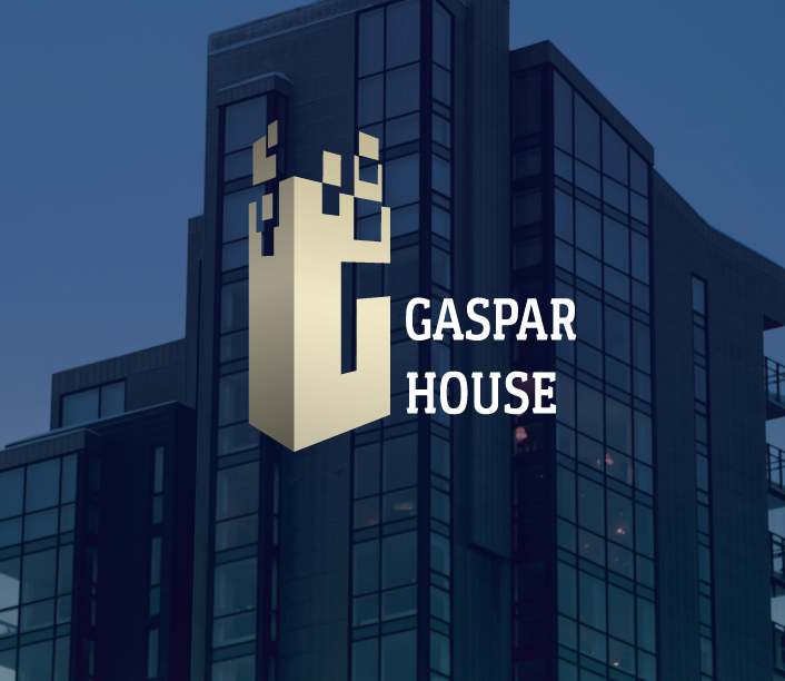 Gaspar House logo on a night-time building facade